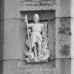 Detail of left hand carved panel of bay on west face of castle