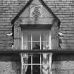 Detail of dormer with carved panel on south face of east block of castle