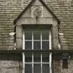 Detail of dormer with carved panel on south face of east block of castle