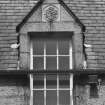 Detail of dormer with carved panel on south face of east block of castle