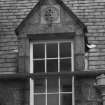 Detail of dormer with carved panel on south face of east block of castle