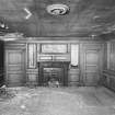 General view of interior of North apartment on first floor of old North block showing fireplace and panelling on North wall.