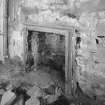 Interior. N range, ground floor, W room W wall detail of roll moulded fireplace