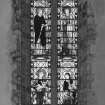 Interior. Detail of nave SW window depicting James and John above Christ blessing little children