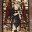 Detail of stained glass window depicting an angel playing a small harp