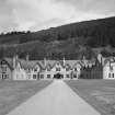 View from South on axis of main front showing the lodge in its setting