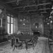 Interior. Ground floor view of dining room from East showing original furnishings, fittings and stags heads installed for the Earls of Fife