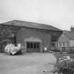 General view from E, showing the former granary block forming the E side of the building (now used as workshop and store for cabinet maker, but previously converted to ice store for white fish following erection of fish processing works on W side in 1896)