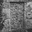 Detail of blocked-up doorway (dated 1720) in North aisle.