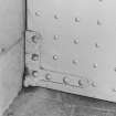Interior, cell block.
Detail showing door hinges.