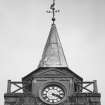 Detail of spire from west showing clock and 1896 date