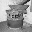Interior.
Detail of one of the two sets of millstones, chute and hopper.