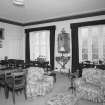 Interior. First floor. Drawing room showing the windows (dining table and chairs not originally in the room)