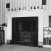 Interior.  First floor Upper level suite. Study. Detail of fireplace with register grate