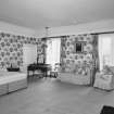 Interior.  Second floor. Principal guest bedroom with dramatic floral wallpaper.