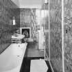 Interior.  Second floor. '1970's military cartoon wallpaper bathroom'