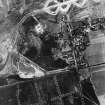 RAF WWII vertical aerial photograph of the NE part of Dallachy Airfield during the construction phase.  Visible is part of the perimeter track and taxiways.  Also visible is the small village of Nether Dallachy and an area of freshly dug anti-landing ditches to the NE of the village.