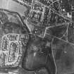 RAF WW II vertical air photograph of the central area of Elgin.  Visible is the Cathedral, the newly built housing estates of Kingsmills and in Chanonry Road.  Also visible is part of the Newmill of Elgin foundry.