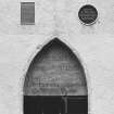 Detail of inscribed panel over door with information plaques above