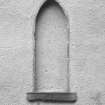 Detail of blocked arched window at ground floor level