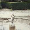 View of pond and cherub statue.