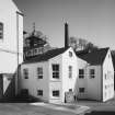 View from NW of offices and Boiler House chimney.
