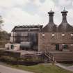 General view of main production block of distillery (left: Still House, centre: kilns) from W