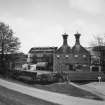 General view of main production block of distillery (left: Still House, centre: kilns) from W