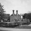 General view of main production block of distillery (left: Still House, centre: kilns) from NW