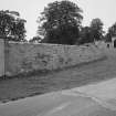 Wall (leading up to gateway), view from South West