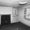 Interior.  Ground floor, living room, view from W showing fireplace and windows