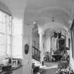 Interior. View of barrel vaulted ground floor hall from E and staircase