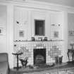 Interior. Detail of drawing room fireplace showing curved panelled recess