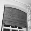 Interior. Detail of drawing room window wooden roller shutters