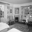 Interior. View of first floor SW bedroom from NE showing french doors onto the balcony above the loggia