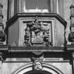 Detail of armorial panel over entrance.