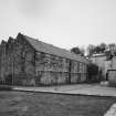 General view of main production block of distillery from NE (including former Maltings to left).