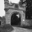 View of gateway with heraldic panel from west