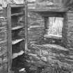 Stone-shelved cupboard in north angle of south east apartment of dwelling