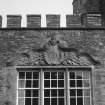 Detail of carved lintel above dining-room window on south front