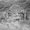 Gable end of dwelling (formerly with canopied fireplace?) onto which kiln abuts behind