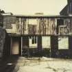 Photographic copy of colour polaroid showing general view of curing shed and packing loft.