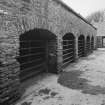 Courtyard, view of cart-shed from North East.