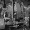 Detail of petrol paraffin engine showing cam shaft, magneto, push rods and governor