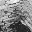 Remains of wooden tie spanning angle in byre