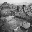 Byre dwelling, from north west showing entrance-doorway in west wall and stone kerb
between former kitchen and byre