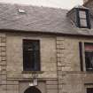 Detail of first floor windows and dormer.