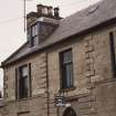 Detail of first floor windows and SW dormer.