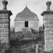 Gate piers and mausoleum from south