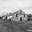 View of E end of former creamery from SE